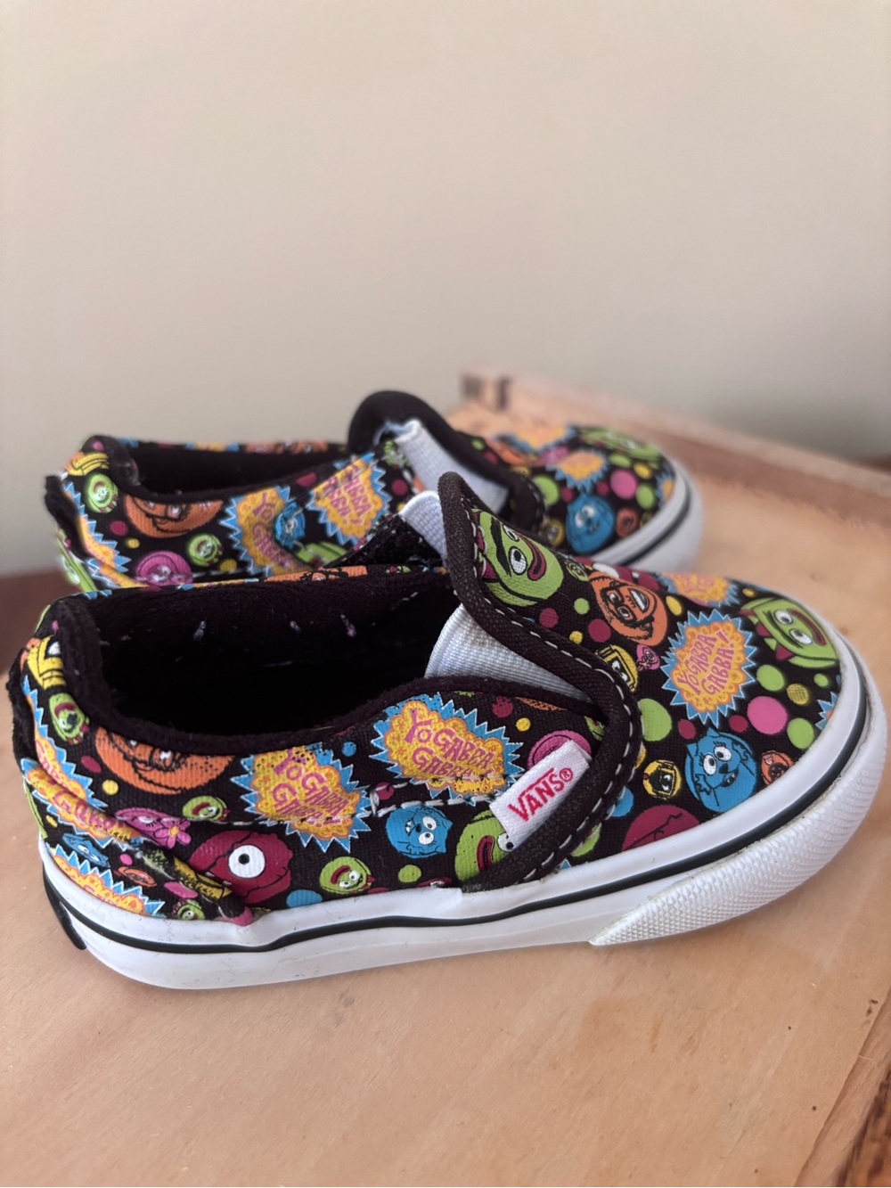 Vans Kids Slip-On Sneakers in Black with Multicolor Monster Print